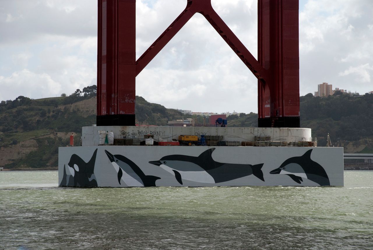 Dolphins painted on the bridge tower base-Lisbon, April 25th bri