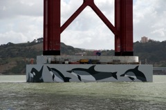 Dolphins painted on the bridge tower base-Lisbon, April 25th bri